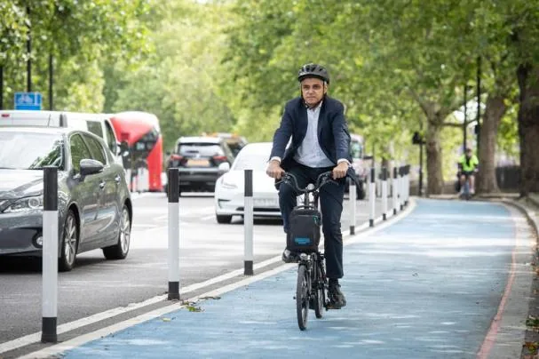 Sadiq Khan, mayor of London, Labour and Muslim, on a city bike lane